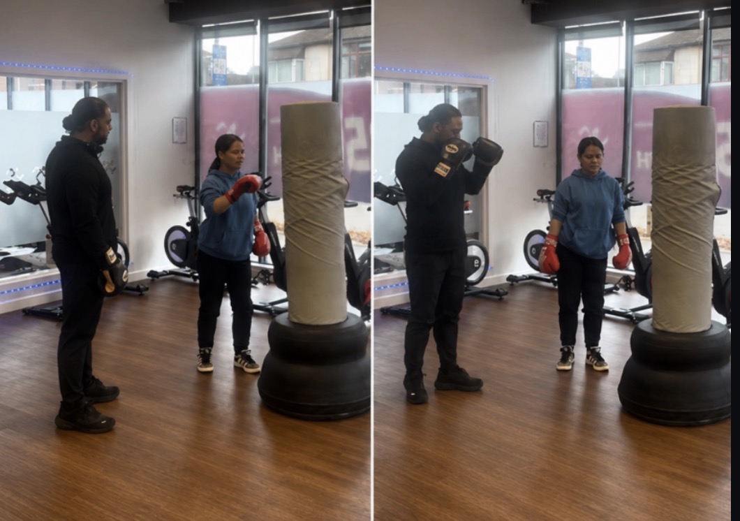 A one-to-one boxing session in a community gym.
