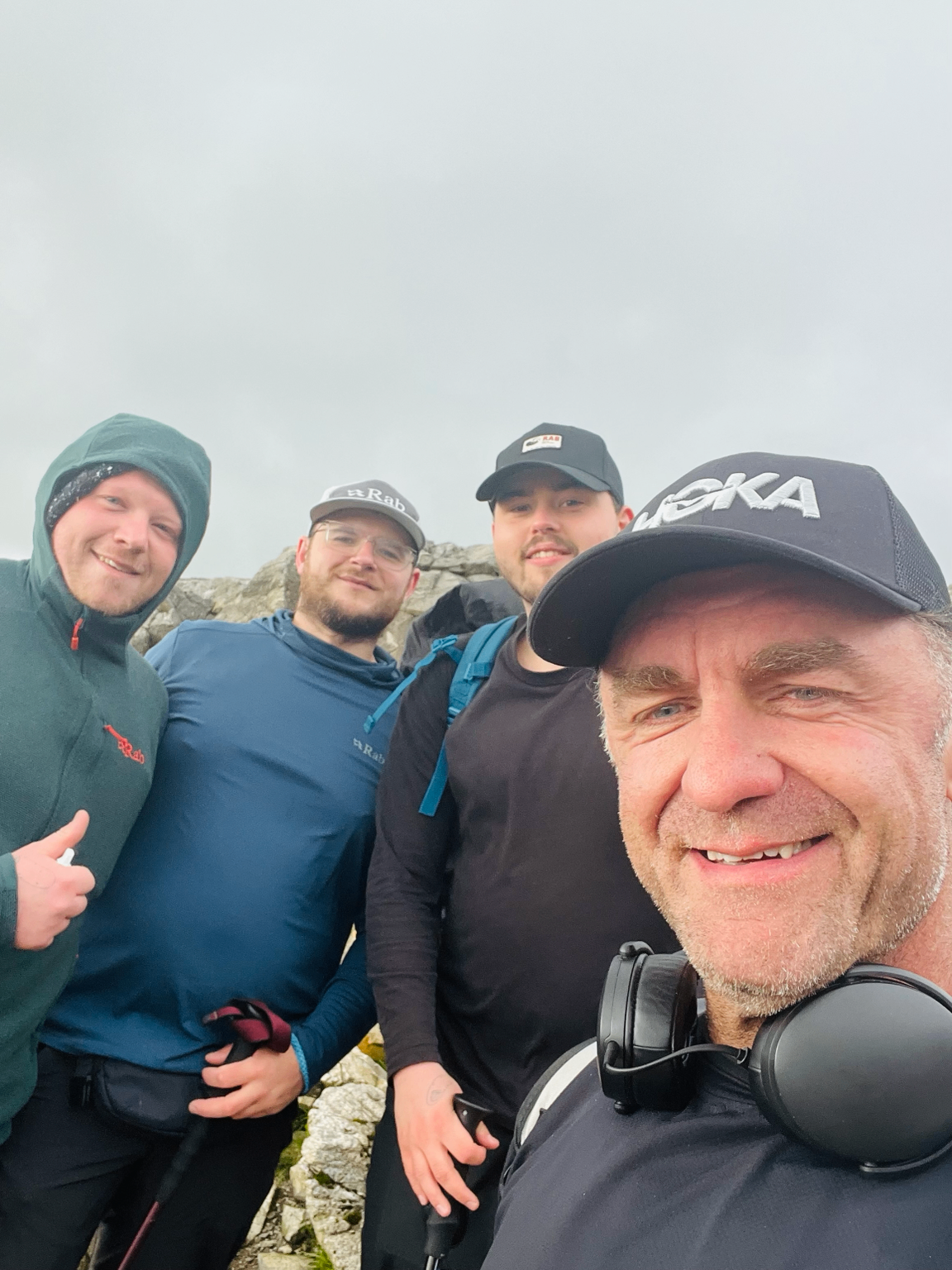 Rob and a Sidekick group at a summit in the hills.